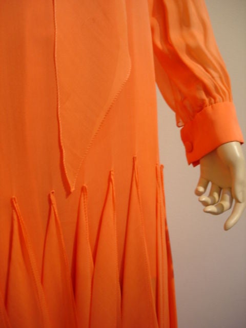 Red orange silk chiffon full length handkerchief gown with self attached scarf.