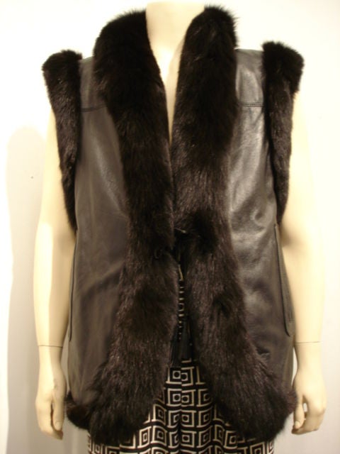 Reversible mink/leather vest with pockets lined in velvet.