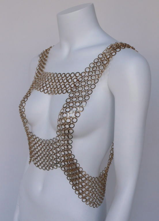 Vendome replaced Corocraft, the high end costume jewelry line of Coro,  in 1944. It became most popular in the early 60's.  <br />
<br />
This very rare chain mail vest was designed in the early 60's. It has a closure of a hook in the back to