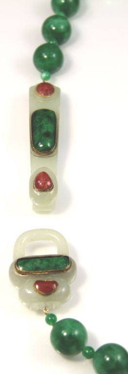 A Unique and Fantastic Antique Jade Buckle, accented with Jade & Coral, set in Gold bezels, measuring 5