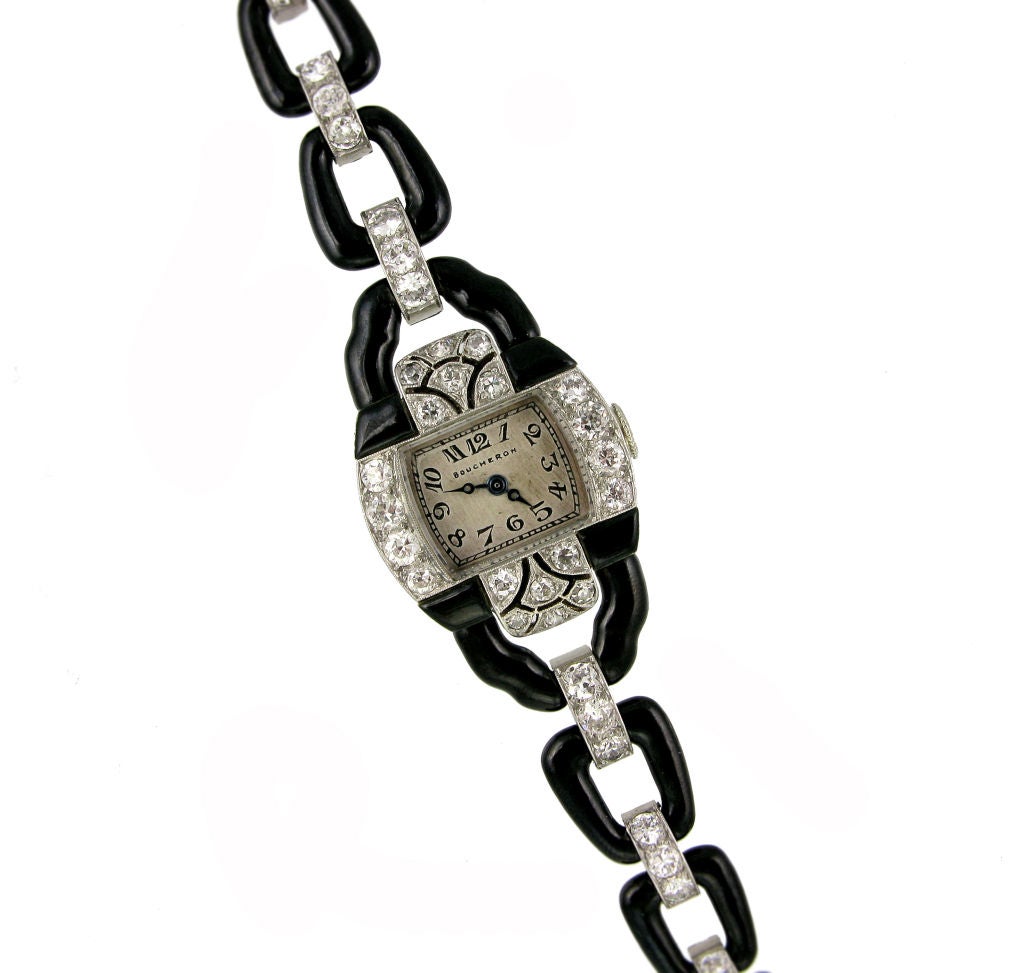 An Art Deco handmade black enamel and diamond bracelet watch of graduating open link design, in platinum. Boucheron, Paris. Atw 3.71 cts. G-I Color, VS1/VS2 Clarity.