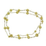 Intricately designed long 18K gold bead necklace. Vintage Intricately designed long 18K gold bead necklace.