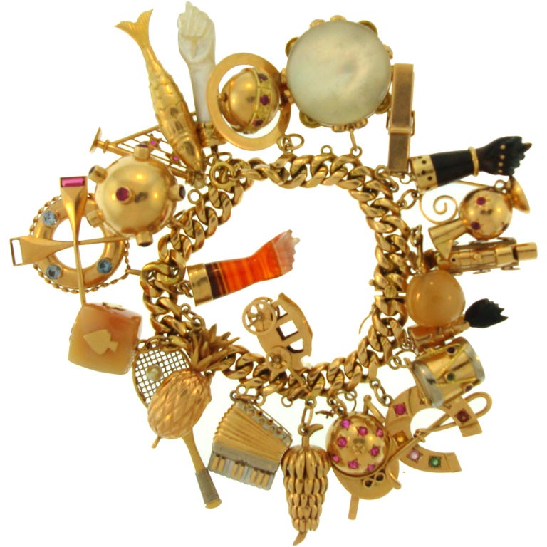 18K gold charm bracelet with 18K and 14K gold charms