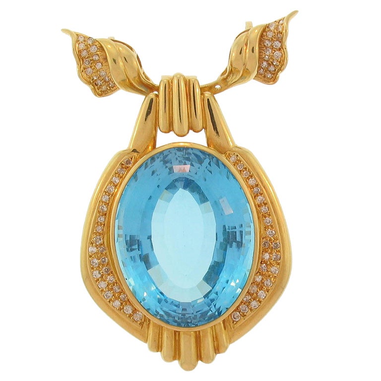 Gold pendant with large faceted blue topaz at 1stdibs