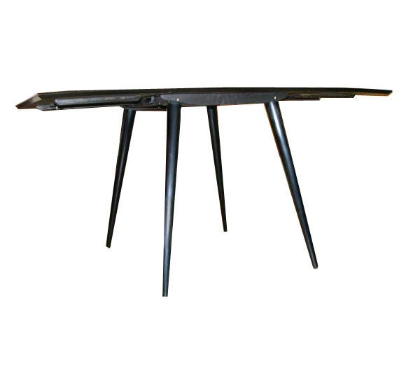 Simple and practical yet elegant drop leaf table designed by Paul McCobb, restored in a piano finish black lacquer over solid maple construction.  each drop leaf is 17