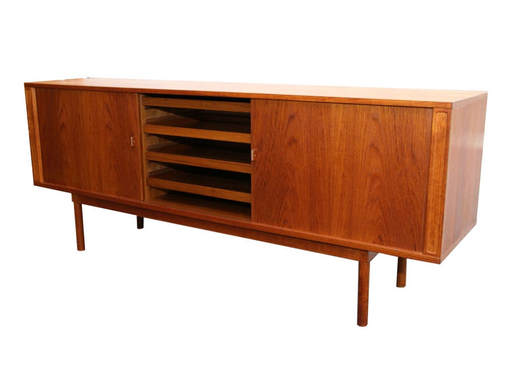 Early Danish modern Tamboor door Teak credenza designed by Jens Quistgaard for Lovig Ca.1960. Fully outfitted interior adjusts for both small and large items with removable and adjustable trays and shelves.Gorgeous tamboor doors slide into left and