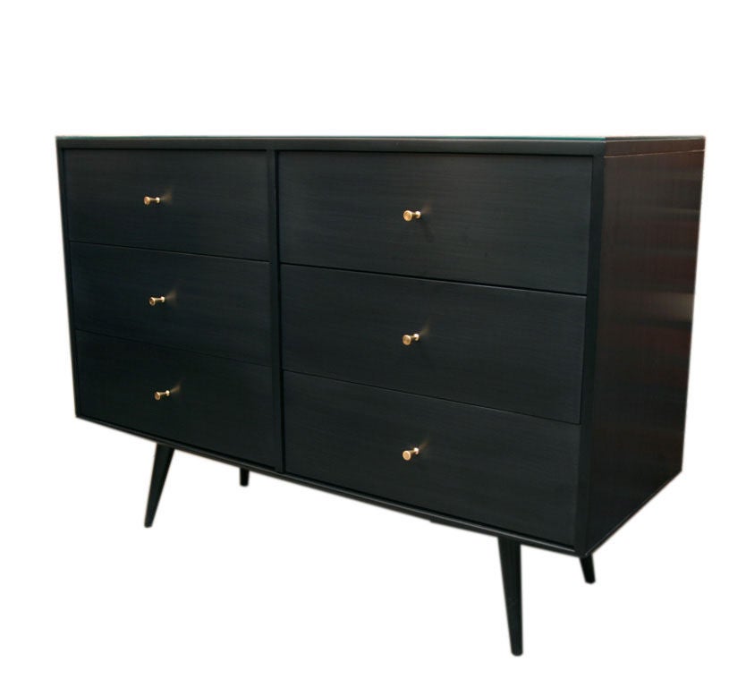 Paul McCobb planner group six-drawer dresser.

Paul McCobb (1917-1969) is an American designer best known for the Planner Group, his collection of clean, utilitarian and well-priced modular residential furniture that was an instant success. From