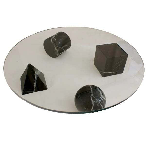 The Metafora Euclid coffee table was designed By Lella and Massimo Vignelli for ICF(International Contract Furnishing Home Inc.) of New York. The base is of negro marquina marble and consists of four geometric shapes--a cube, pyramid, cylinder &