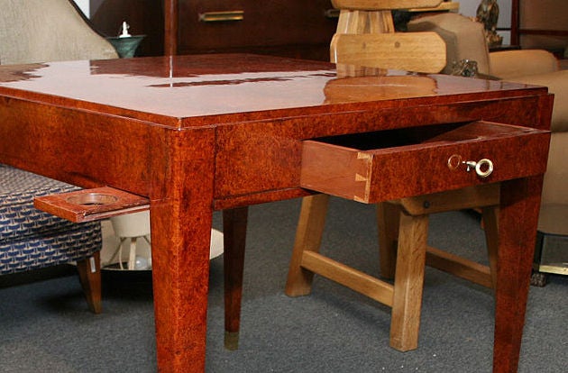 Square Amboyna Art Deco Game Table<br />
with reversible felt top & gilt brass sabots.