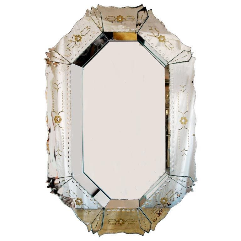 Antique octagonal Venetian mirror with scallop and stud motif and gold floral etched decoration.