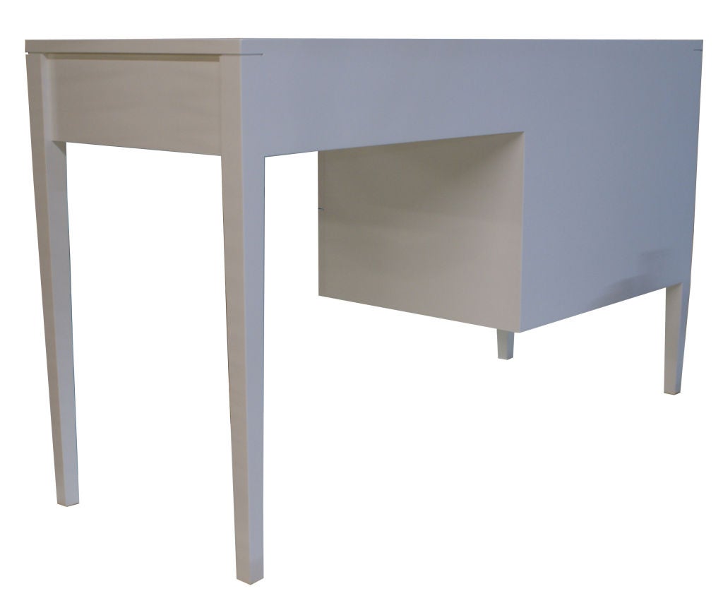 Mn originals four-drawer white lacquered desk featuring solid polished brass conical hardware. Satin white lacquer finish over maple frame. Custom ordered and fabricated by Modern Living Supplies.

Custom orders have a lead time of 10-12 weeks FOB