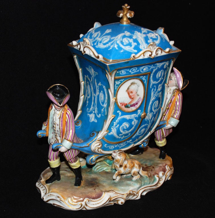 French Paris porcelain figural group depicting Marie Antoinette borne in her carriage with small dog following. Carriage has removable top cover. Beautifully-painted detailing, and very unique depiction.