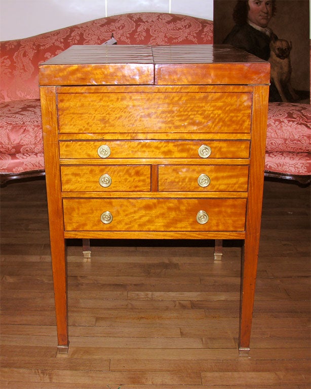 English, George III. Satinwood Beau Brummel. Rectangular double hinged top, later marble insert, two short and two full drawers raised on tapered legs.