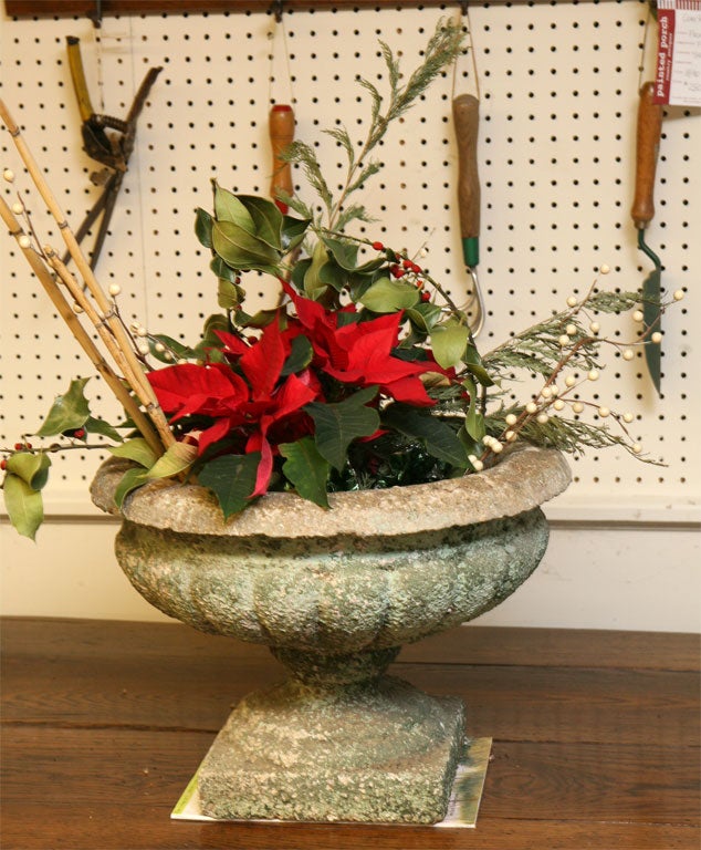 This is our best concrete garden urn and with think it is a beauty. the patina on the fluted bowl and base is fabulous. it would be great in a garden or inside the home , as a centerpiece.