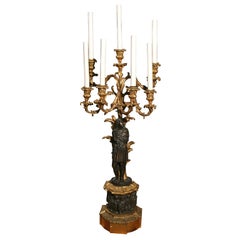 A Patinated and Gilt Bronze Candelabrum