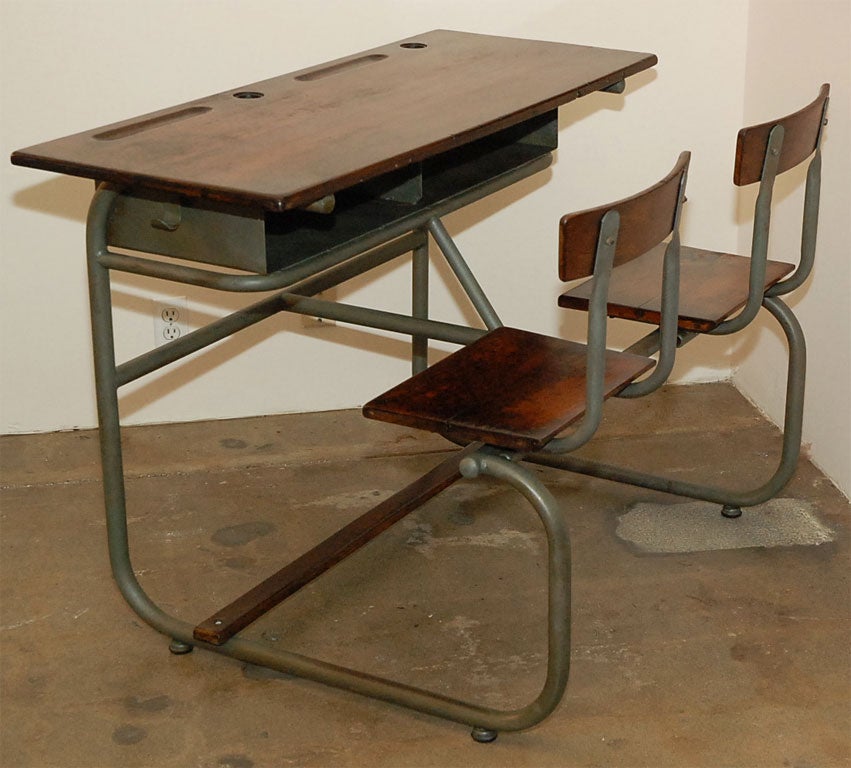 Charming school house desk.  Metal frame supports rustic wood top and chairs.  Great for children's playroom, family room or kitchen.