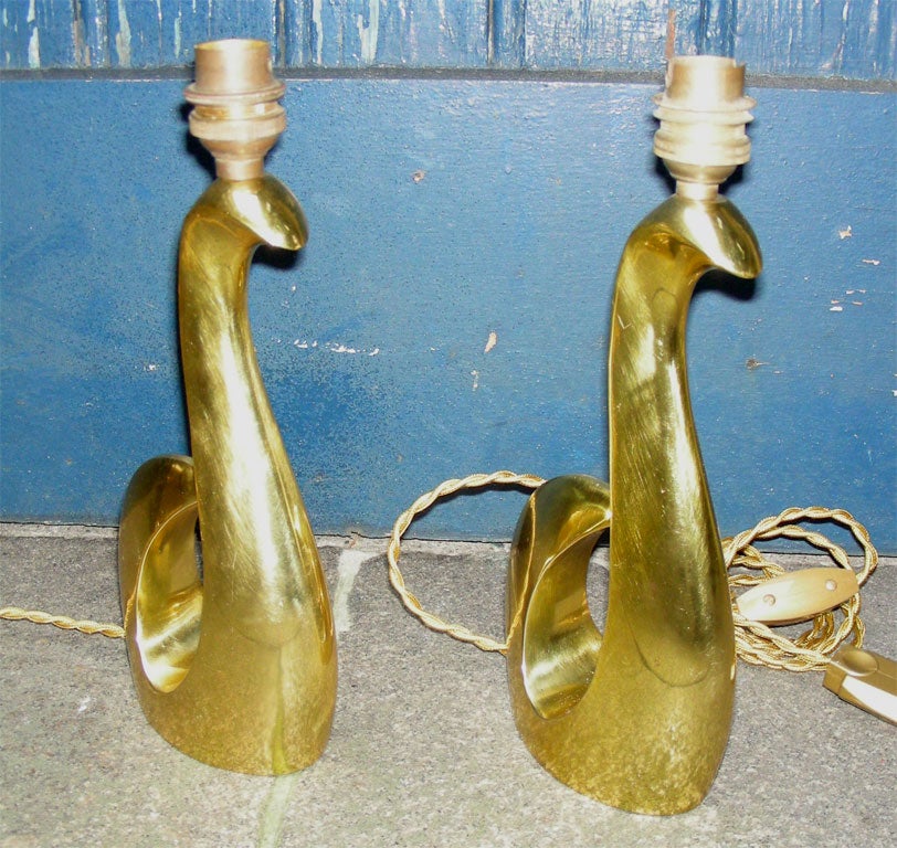 Two 1950s gilt bronze lamps, shaped like an abstract swan, re-polished and re-varnished, signed by Scarpa.