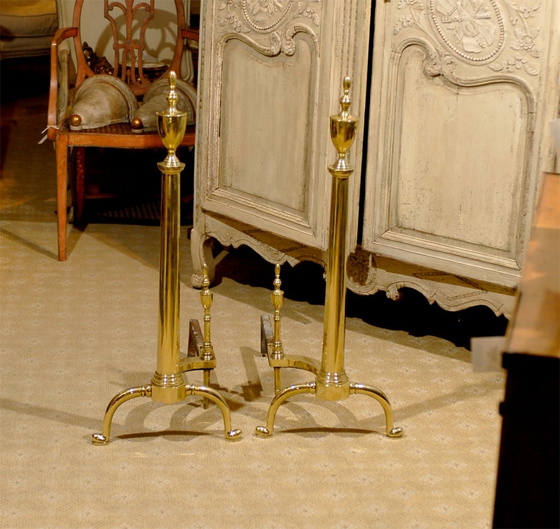 Pair of 19th-20th century American Federal style brass andirons.