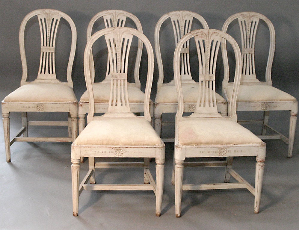 Set of 6 Swedish Gustavian centennial dining chair with wheat sheaf carving on the splats. Tapering turned legs and H-shaped stretchers. Slip seats