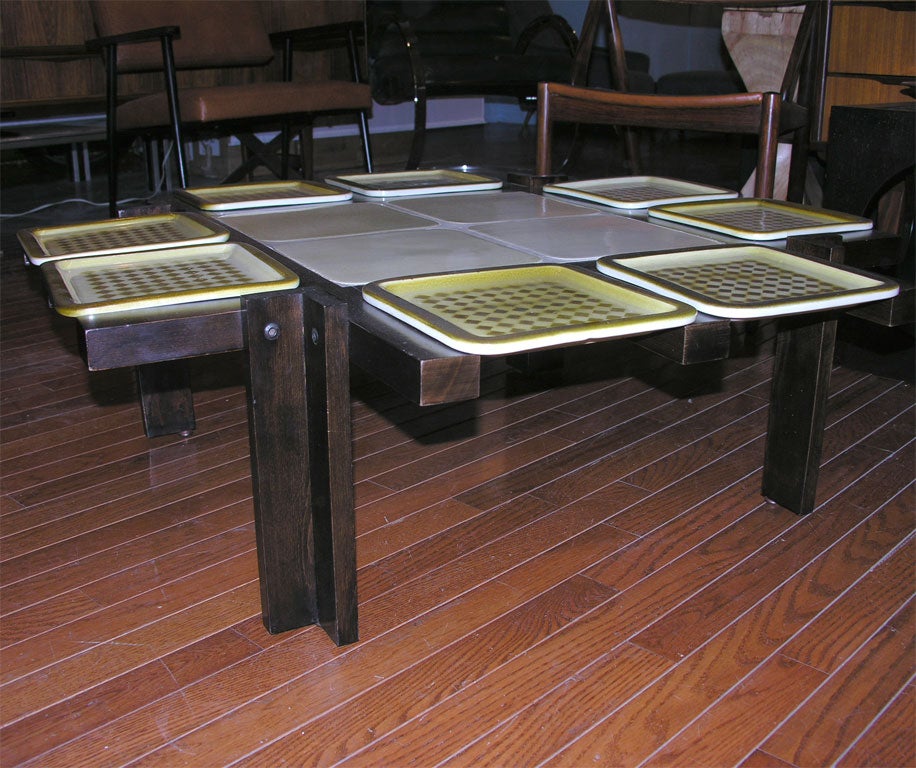 Coffee table with tile inlay and 12 removable plates.