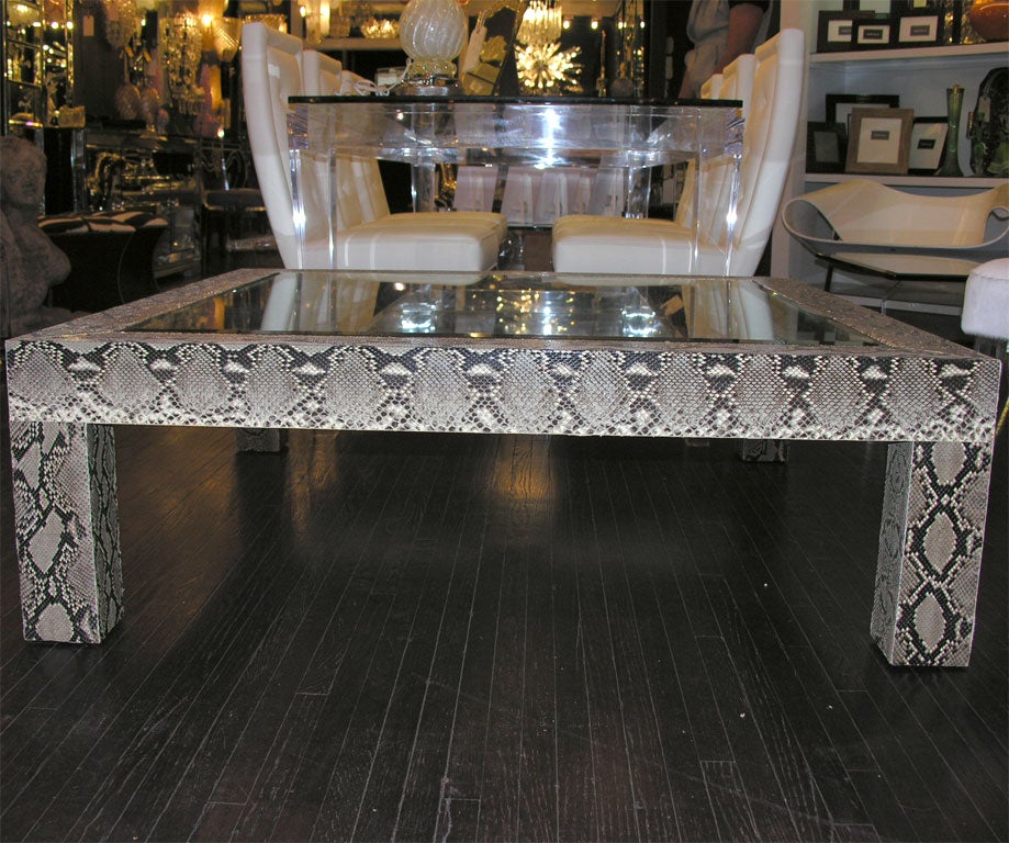 Python cocktail table with inset glass top. Customization is available in different sizes and colors.