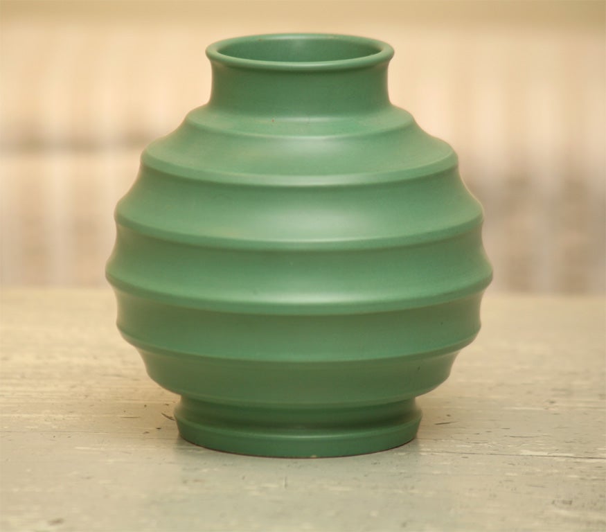 Wedgwood : Keith Murray Design : Matte Green Glaze Vase. England c. 1935<br />
Globular Ribbed Ornamental Design