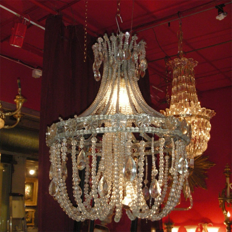 1910-1920 chandelier used in an alcove, drops and pearls in crystal, structure in silver bronze. Re-wired for electricity.