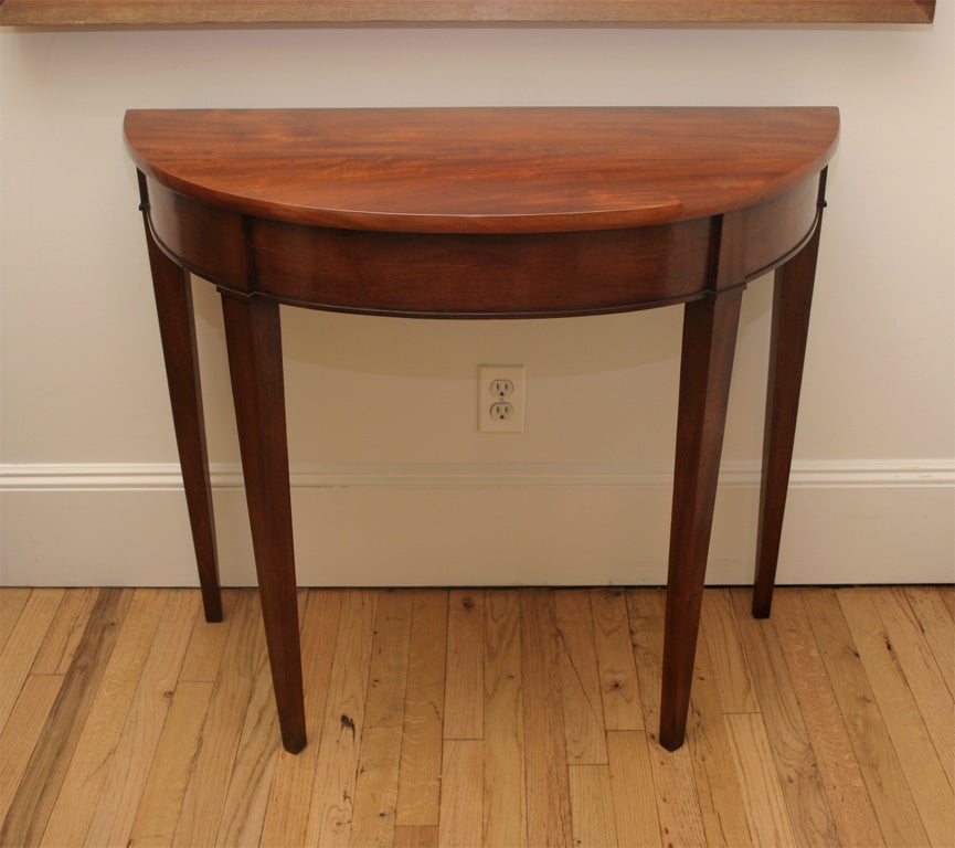 Pair of Mahogany Demi-lunes with Tapered Legs.