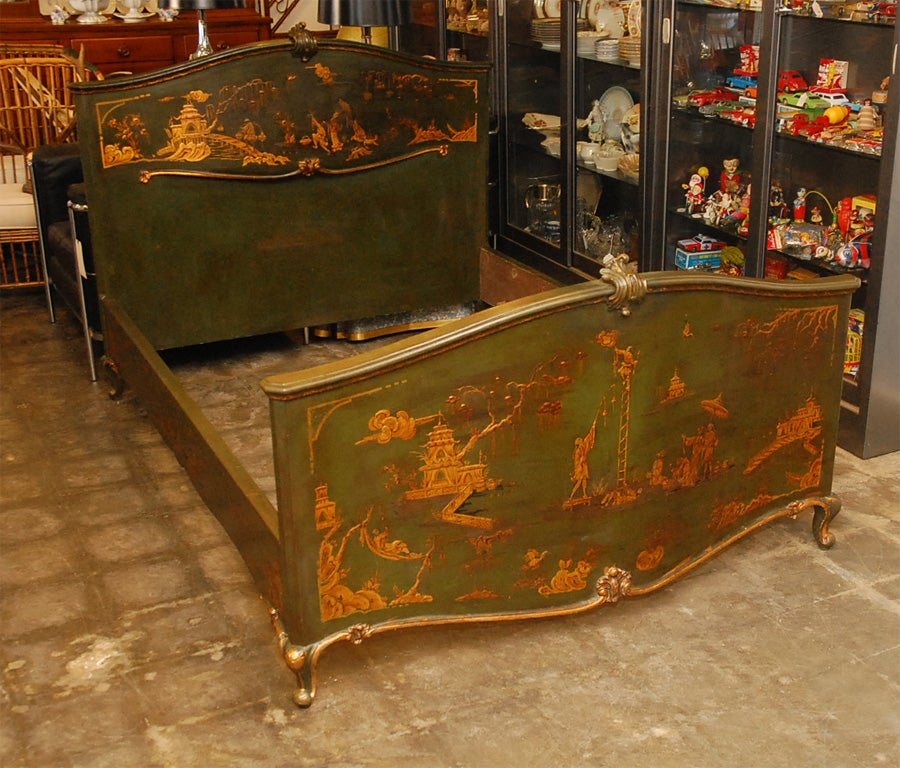 This bed has aged nicely, it is thought to be French and from the earlier part of the last century. Decorated with a variety of raised figures and other fanciful Pseudo-Chinese elements, which are portrayed in gilt with further shading and black