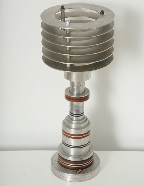 An original Pattyn lamp- an iconic tribute to machine age design in America. This lamp is aluminum bakelite and glass- complete with original Pattyn label. It is of a very limited edition by Pattyn Products - of Michigan.