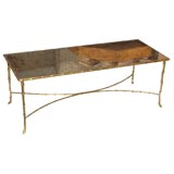 Bronze and glass coffee table, in the style of La Maison Bagues