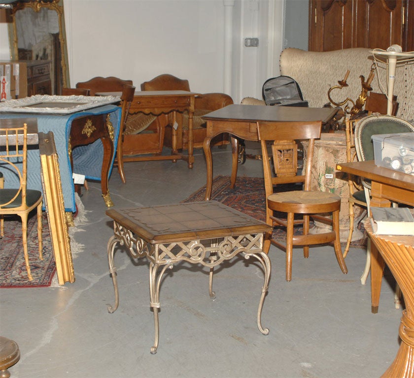 Louis XV style iron and leather top table