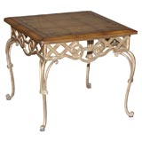 Louis XV style iron and leather top table