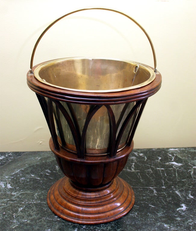 9948-Fine Dutch carved and turned fruitwood jardiniere with stepped and lobed base supporting pointed arches and a ribbed top edge, with a brass carrying handle and liner. c.1870