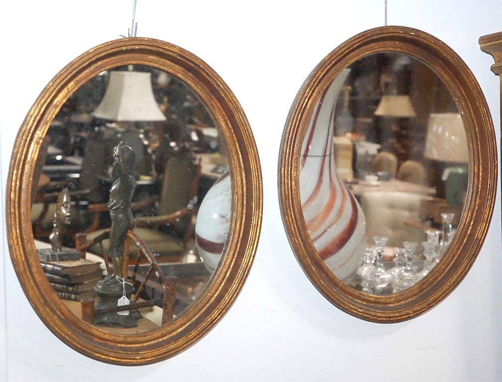 Pr Mirrors in Oval Gilt Frames