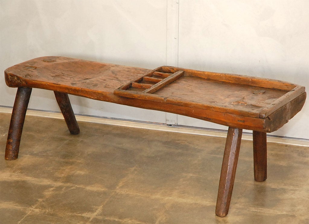 This work bench looks old and has the obvious signs of past use and old age. There is a scalloped area for the cobbler to sit and a divided work surface. Just the piece to add interest to a period or other setting. Jefferson West antiques offer a
