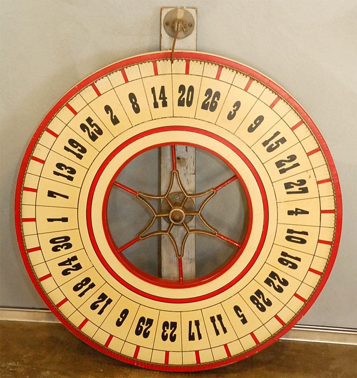 This wheel is brightly colored in red and cream with black numbers. It has a mounting board and is ready to be placed in that spot you want to add interest. Jefferson West antiques offer a large selection of interesting decorative accessories,