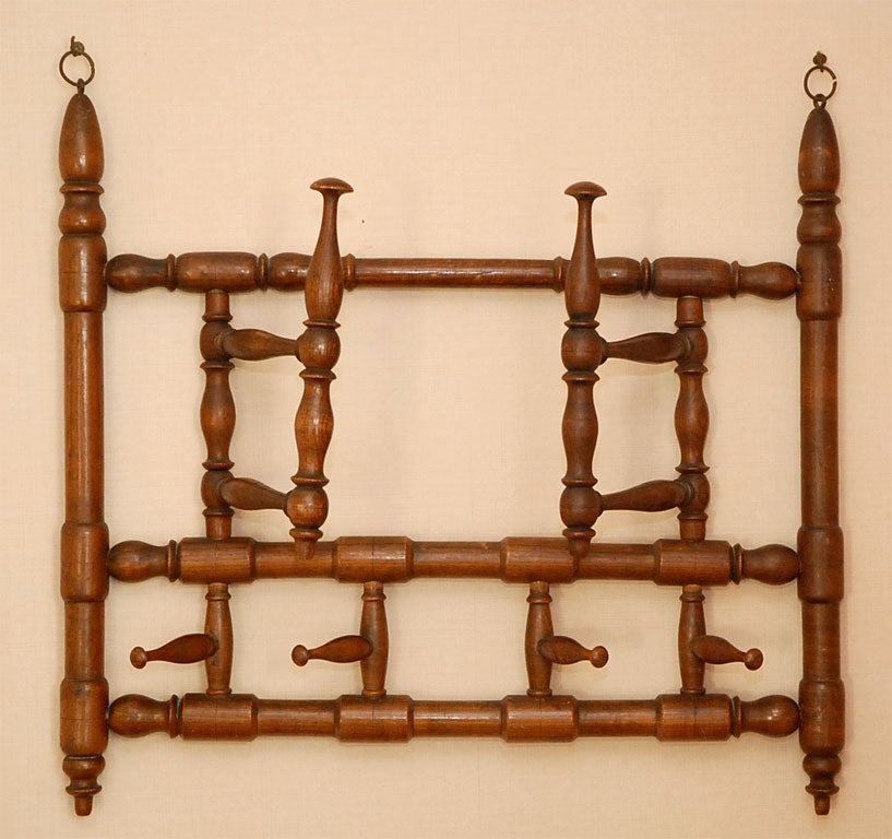 Very attrative walnut wall hat or towel  rack. with fine details in carving
