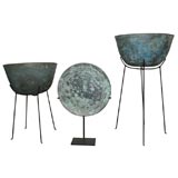A Collection of Bronze Vessels on Stands.