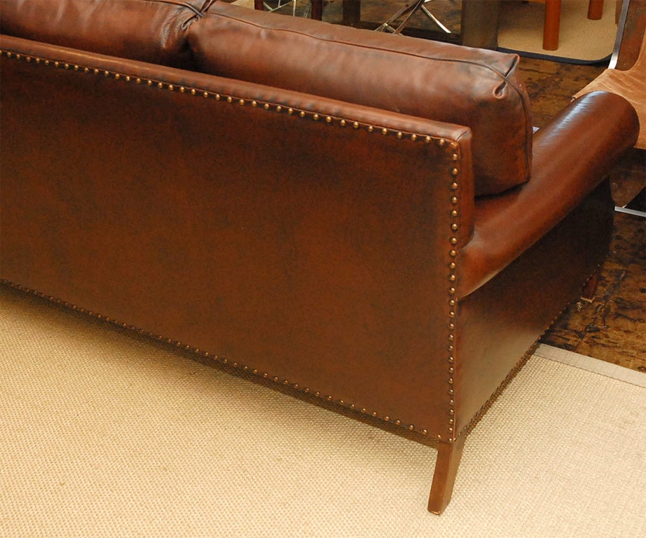Classic leather sofa on brass casters In Excellent Condition In Los Angeles, CA