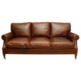 Classic leather sofa on brass casters