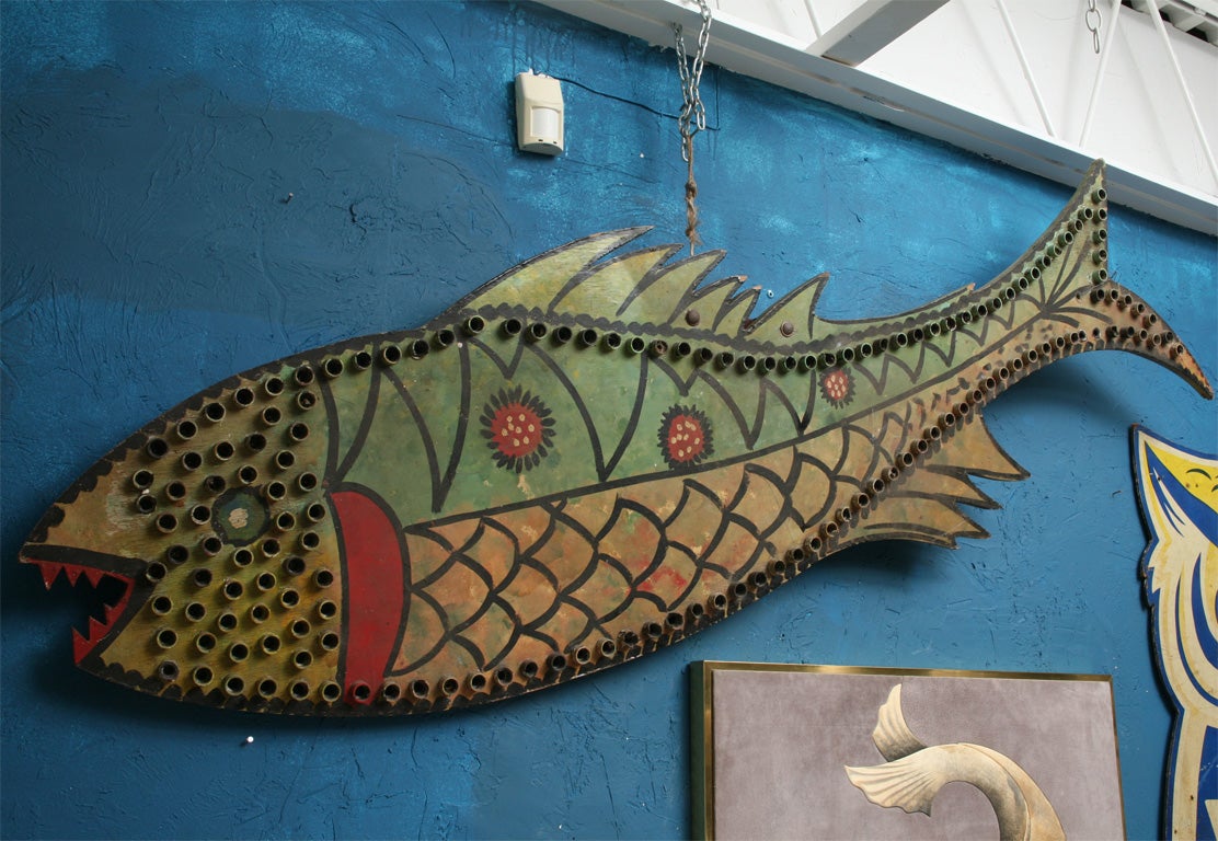 Whimsical fish carnival light, wonderfully painted in naive style.