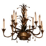 TWELVE LIGHT ANTIQUED BRASS FIXTURE IN LEAF DESIGN
