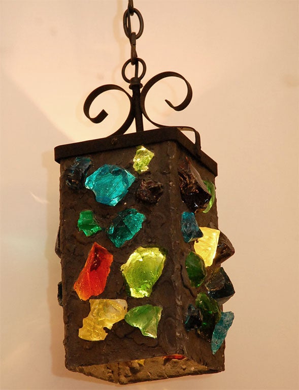 Lava Composition with Inset Glass Crystal Lantern with Iron Fittings.