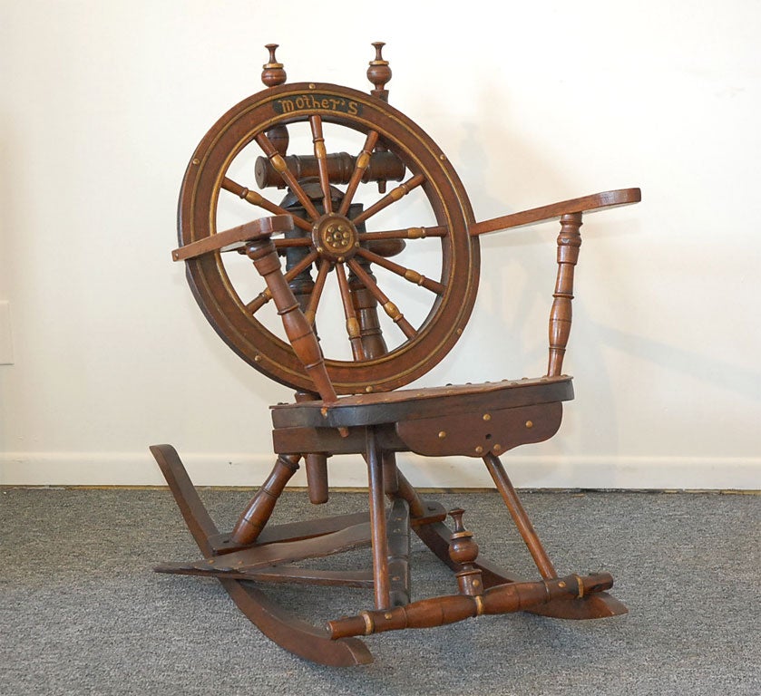 19THC FOLKY HANDMADE SPINNING WHEEL ROCKING CHAIR. MADE FROM A EARLY 19THC SPINNING WHEEL.ALL ORIGINAL SURFACE AND 