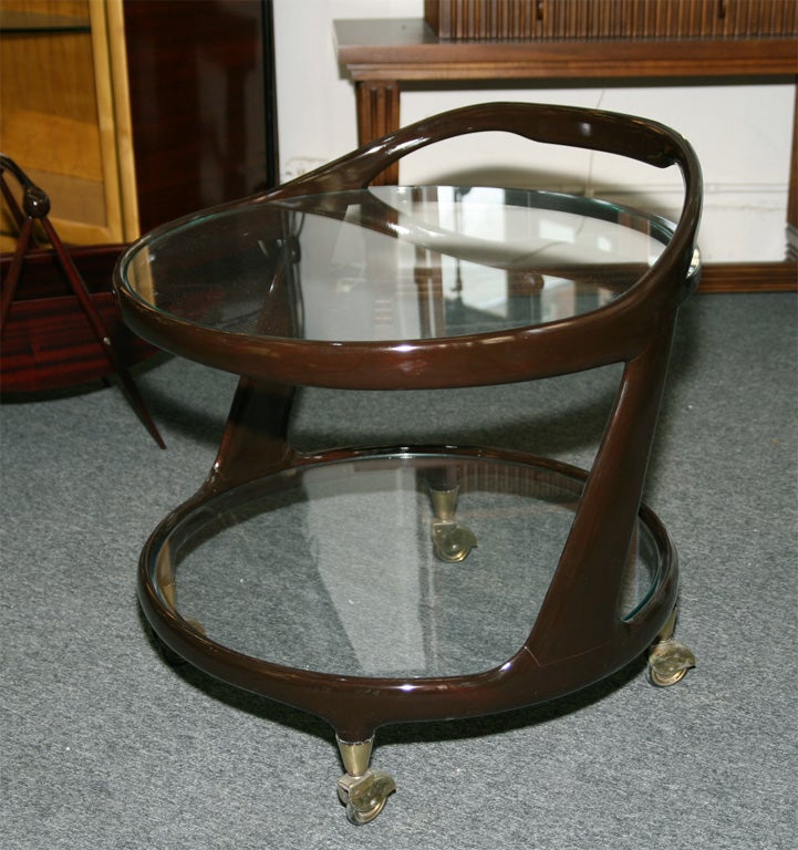 BEAUITFUL 2 TIER BAR CART IN A MAHOGANY FINISH MADE IN MILAN 1950, DESIGNED BY CESARE LACCA. ALSO WORKS WELL AS A SIDE TABLE,GREAT FORM.