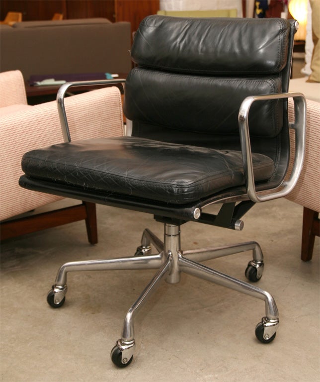 Charles Eames black leather soft pad desk chairs on castors with swivel, tilt and adjustable height.