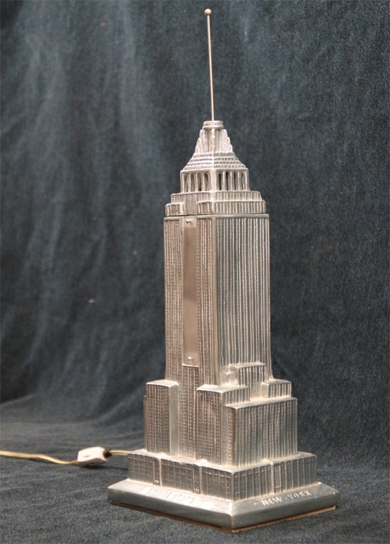 Illuminated Empire State Building in <br />
polished aluminum. Functions as a <br />
lamp,and makes a great decorative <br />
object as well as a collector's item.