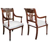 A Pair of Carved Arm Chairs