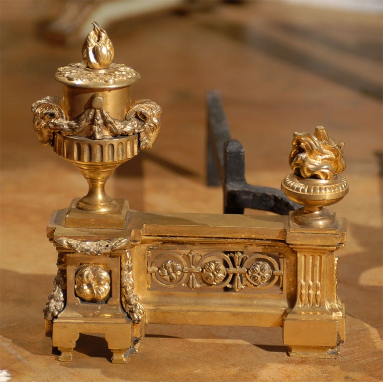 Exquisite Pair of 19th c, French Dore Bronze andirons having flaming urn design surmounted with pierced frieze.